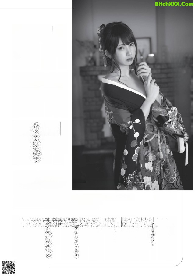 A woman in a kimono is posing for a magazine.