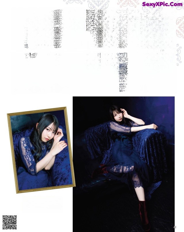 A woman in a blue dress sitting on a couch.